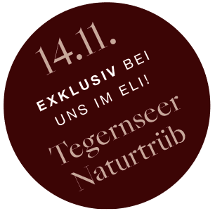 Rote Kreis mit Schriftzug 14.11. Exklusiv bei uns im ELI – Tegernseer Naturtrüb